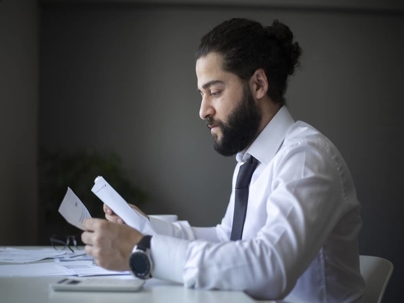 a man looking at documents